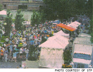 Crowd in front of booths.